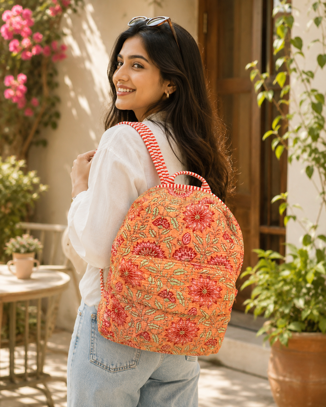 Model carrying a pink patchwork quilted tote